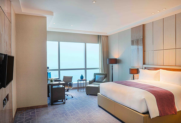 bedroom of luxury hotel suite in Hanoi